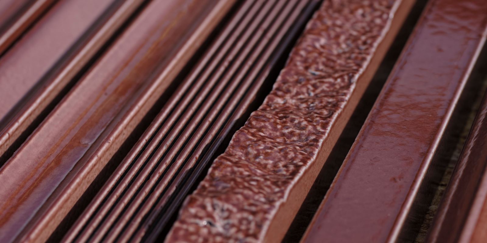 Close-up of the 3D relief texture of the Odissea Bar tile