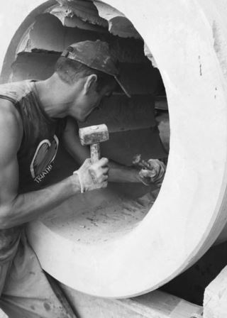 Process of creating custom lava stone vases, with details of hand-carved shapes.