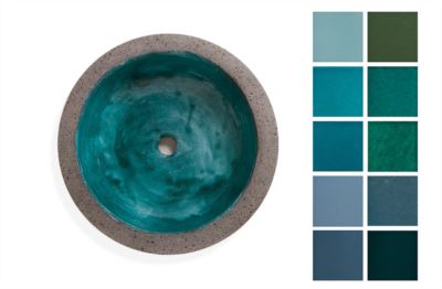 Round lava stone sink with a turquoise glazed interior and a range of color samples on the side